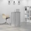 A reception desk with a chair and shelving unit in an office setting. Podgląd zdjęcia produktu