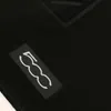 A close-up of a black car floor mat with a white logo. Produktbild-Vorschau