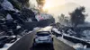 A rally car driving on a snowy mountain road during sunset. Produktbild-Vorschau
