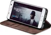 A Samsung Galaxy S7 phone in a brown flip case, displaying a movie poster on its screen. Produktbild-Vorschau