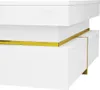 A close-up, studio shot of a white, modern coffee table with gold accents. Produktbild-Vorschau