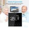 An elderly couple is smiling in the background, with a thermostat in the foreground displaying temperature and time settings. Podgląd zdjęcia produktu