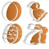 Four Easter-themed cookie cutters with gingerbread cookies. Podgląd zdjęcia produktu