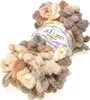 A ball of fluffy yarn with loops, in various neutral colors. Anteprima dell’immagine prodotto