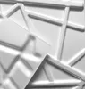 A close-up view of white 3D wall panels with a geometric pattern. Produktbild-Vorschau