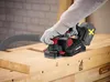 A person wearing gloves is using a cordless planer on a wooden workbench. Produktbild-Vorschau
