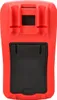 The back of a red and black digital multimeter. Produktbild-Vorschau
