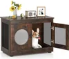A dog is inside a wooden dog crate that is styled like furniture. The crate has a door and a circular window. Náhled obrázku produktu