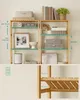 A collage showing a multi-tiered shelf unit with various decorative items and measurements indicated. The bottom part of the collage shows a closer view of the shelf construction. Produktbild-Vorschau