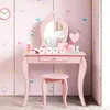 A pink children's vanity table with a stool and mirror, decorated with cartoon characters. Náhľad obrázku produktu