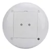 The bottom of a white, round object, likely a speaker, with a square compartment in the center held by two screws. There are also three small circular feet visible around the perimeter. Produktbild-Vorschau