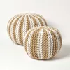 Two knitted poufs, one larger than the other, are placed on a white background. Produktbild-Vorschau