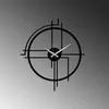 A modern, minimalist wall clock with a black metal frame and white hands, set against a gradient gray background. Produktbild-Vorschau