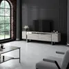 A modern living room with a TV stand, coffee table, and armchair. Voir les images du produit