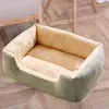 A pet bed on a wooden floor, with a chair leg and part of a chair in the background. Produktbild-Vorschau