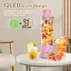 A pink portable blender filled with fruit sits on a table next to drinks and fruit slices, with marketing text overlayed. Produktbild-Vorschau