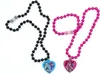 Two Monster High themed necklaces with heart-shaped pendants. Produktbild-Vorschau