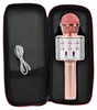 A pink karaoke microphone and its charging cable are shown inside a black carrying case. Podgląd zdjęcia produktu
