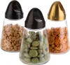 Three glass snack dispensers with different colored lids and filled with different snacks. Produktbild-Vorschau