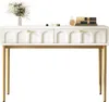 A white sideboard with gold legs and two drawers, decorated with a vase of flowers and makeup items. Podgląd zdjęcia produktu