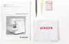 A flat lay of sewing machine accessories and documentation. Produktbild-Vorschau