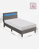 A grey upholstered bed frame with a blue LED light strip at the headboard, shown with dimensions indicated. Náhled obrázku produktu