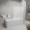 A modern bathroom with a bathtub and a shower screen. Anteprima dell’immagine prodotto