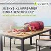 A red shopping trolley bag is open on a wooden table outdoors, with food and drinks. Podgląd zdjęcia produktu