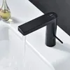 A black faucet with a digital display is shown over a white sink with water running. Podgląd zdjęcia produktu