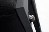 A close-up view of a wheel on a dark-colored lounge chair. Produktbild-Vorschau
