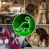 A collage of images showing a bedroom, a couple, a family with a gift, a child reading, and a neon dinosaur sign. Podgląd zdjęcia produktu