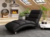 A modern living room with a chaise lounge, fireplace, and plants. Náhľad obrázku produktu
