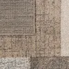 A close-up view of a textured rug with a checkered pattern in shades of brown, beige, and cream. Produktbild-Vorschau
