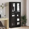 A black wooden cabinet with glass doors is shown in a room with a desk and a plant. Náhled obrázku produktu