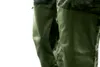 Close-up view of the pocket of a pair of camouflage work pants. Anteprima dell’immagine prodotto