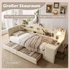 A bed with storage drawers and a built-in desk and shelving unit, set up in a room. Anteprima dell’immagine prodotto