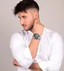A man wearing a white shirt and a watch. Náhľad obrázku produktu