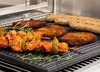 Food being grilled on a grill plate. Produktbild-Vorschau