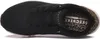 A top-down view of a black Skechers sneaker with a leopard print interior. Anteprima dell’immagine prodotto