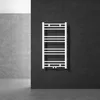 A white towel radiator is mounted on a dark tiled wall in a modern bathroom setting. Náhled obrázku produktu