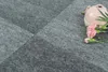 A pink vase with pink flowers on a gray carpet. Produktbild-Vorschau