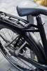 A close-up of a bicycle's rear wheel and lock. Produktbild-Vorschau
