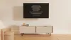 A modern living room with a TV cabinet and artwork on the wall. Podgląd zdjęcia produktu