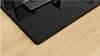 A close-up view of a black gas hob with a wooden countertop. Anteprima dell’immagine prodotto