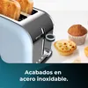 A close-up of a toaster with toast and pastries on a table. Produktbild-Vorschau