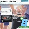 People walking with a shopping trolley on a beach. Produktbild-Vorschau