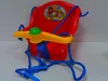 A red plastic baby swing with yellow and green accents, suspended by blue ropes. Náhľad obrázku produktu
