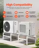 Two outdoor air conditioner units are mounted on white stands in a garden setting. Anteprima dell’immagine prodotto