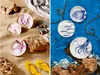 A split image showing beach-themed ceramic plates with marine life designs on sand and in water. Podgląd zdjęcia produktu