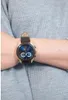 A person wearing a watch on their wrist. Produktbild-Vorschau